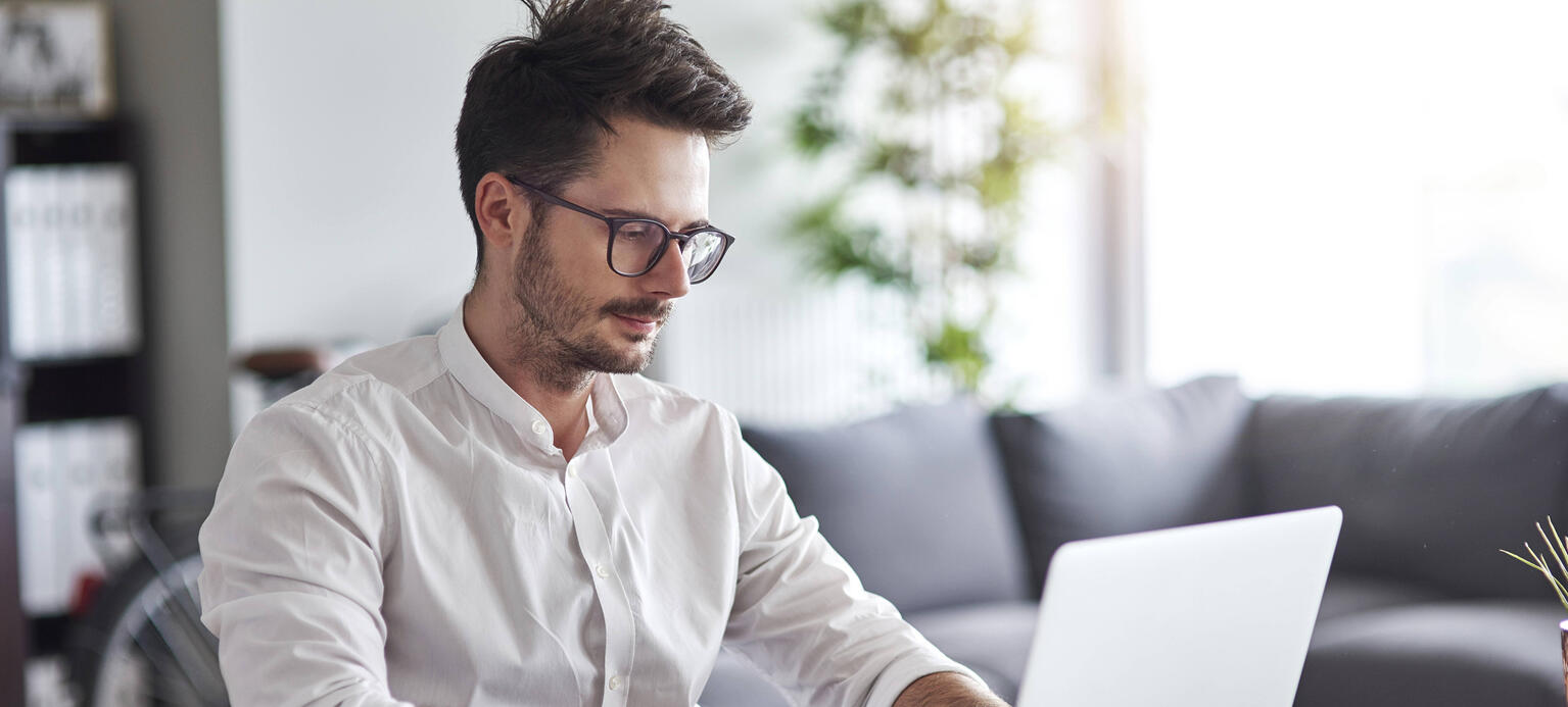 Businessman working on laptop at home office