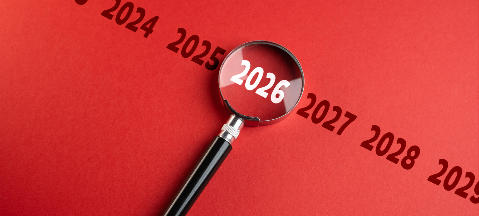 The year 2026 on the year scale in the focus of a magnifying glass. Upcoming trends. Financial forecasting. Strategic vision. Global events in the near future.