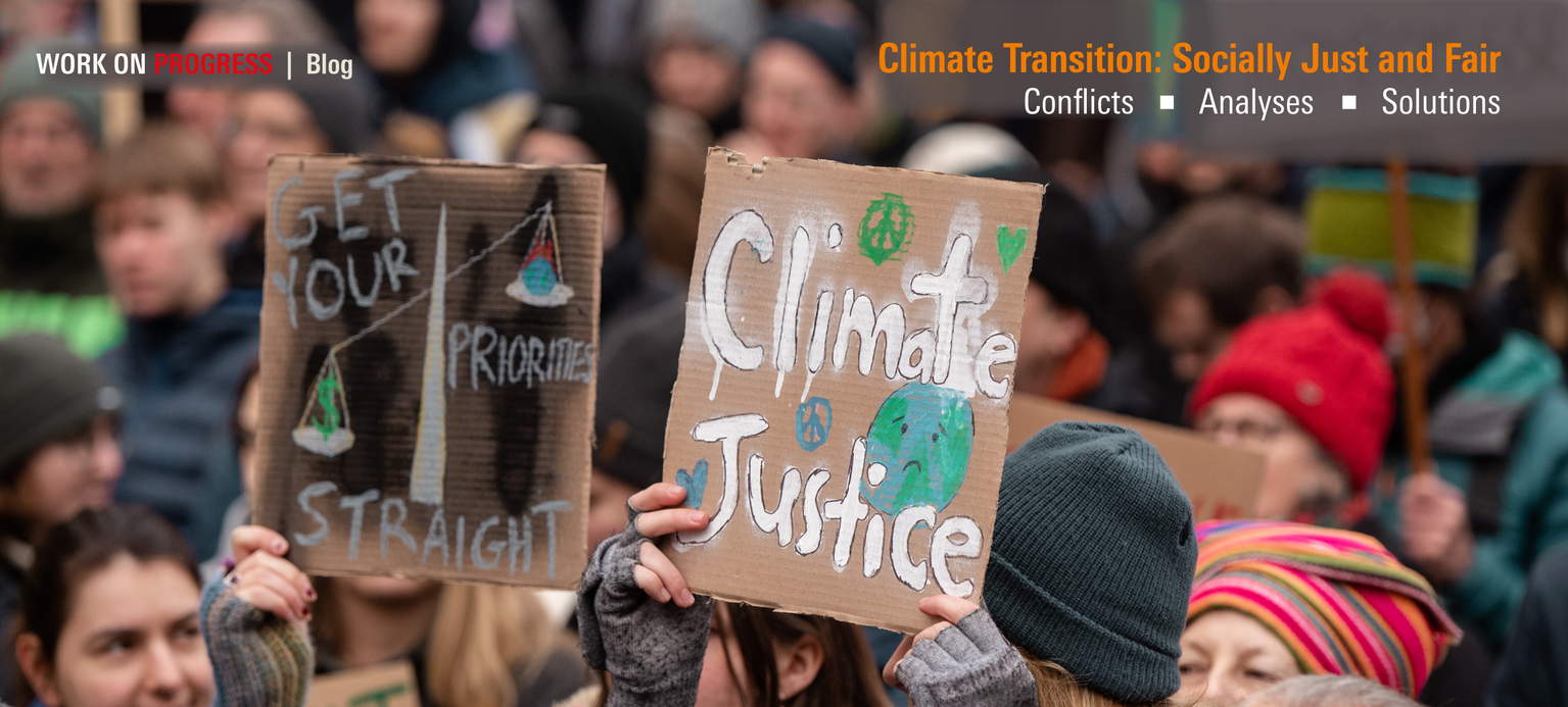 A demonstrator holds up a sign reading “Climate Justice is Gender Justice.”
