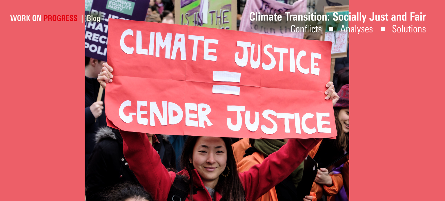 A demonstrator holds up a sign reading “Climate Justice is Gender Justice.”